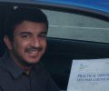 Umar with Driving test pass certificate